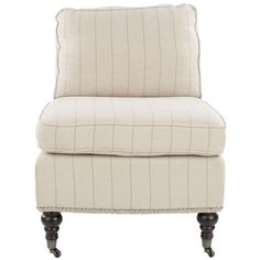 an upholstered chair with black legs and a white striped cushion on the back