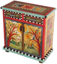 an artisticly painted wooden cabinet with trees and flowers on the doors, in multicolors