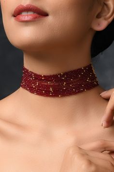 Red Stones Choker Necklace Length - 14 inches DETAILS -100% top Quality -22K gold plated silver copper alloy. -Handcrafted in our all girls workshop in Paisley Pop Studio, Jammu and Kashmir STYLE TIP A simple even dull outfit will almost always look transformed into something special with the right jewellery and accessories. You can choose this choker necklace to bring a simple outfit to life. This look perfect when you are wearing a traditional or indo-western outfit. Handcrafted in Jammu and K Polished Beads Choker Necklace For Gifts, Temple Jewelry Style Gold Plated Choker, Red Gold Plated Temple Jewelry Necklaces, Gold Plated Temple Jewelry Choker As Gift, Red Faceted Beads Jewelry For Party, Red Gold Plated Temple Jewelry, Festive Gold Plated Choker Necklace, Red Gold-plated Temple Jewelry, Elegant Red Choker For Festivals