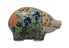 an elephant figurine with flowers and butterflies painted on it