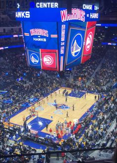 a basketball game is being played in an arena