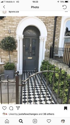 an image of a black and white checkerboard floor in front of a house