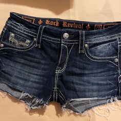 Rock Revival Sherry Low Rise Dark Blue Bling Shorts. Size 27. Clear And Black Crystals And Thick Stitching. Nwot. Bling Shorts, Dark Blue Jean Shorts, Grunge Shorts, Rock Revival Shorts, Thick Stitching, Low Rise Shorts, Summer Glow, Blue Jean Shorts, Dark Blue Jeans