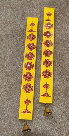 pair of yellow beaded bookmarks with bells