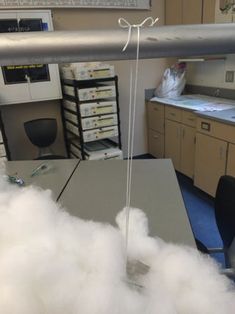 a cloud is hanging from the ceiling in an office