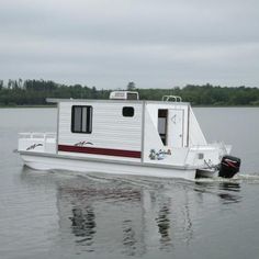 a small house boat on the water