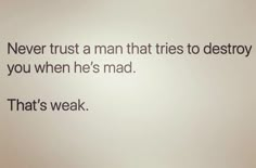 a white wall with a quote on it that says never trust a man that tries to destroy you when he's mad