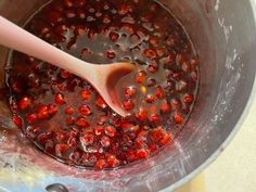 a large pot filled with lots of pomegranate