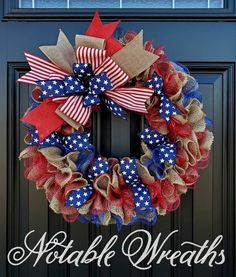 a patriotic wreath is hanging on the front door