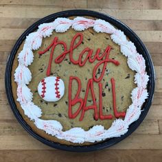 a cookie cake with the words play ball on it