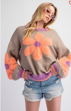 Introducing our Daisy Pattern Knitted Sweater PulloverTop. This stylish top features a unique daisy pattern detail on the sleeves and front, giving it a fresh and feminine look. With long sleeves, a rounded neckline, and a relaxed fit, it is both comfortable and stylish. Made from a soft blend of acrylic, nylon, and polyester, it is sure to keep you warm and cozy all day long. Perfect for any occasion. Trendy Spring Crew Neck Sweater, Trendy Crew Neck Sweater For Spring, Retro Textured Knit Sweater For Spring, Retro Textured Knit Spring Sweater, Spring Soft Knit Crew Neck Sweater, Cozy Crew Neck Sweater For Spring, Cute Crew Neck Sweater For Spring, Trendy Floral Print Crew Neck Sweater, Trendy Knit Tops With Floral Print