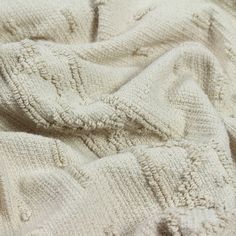 the blanket is made up of white knits