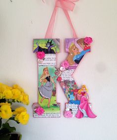 the letter k is made up of princesses and other things to decorate with flowers