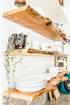 a shelf with plates and bowls on it