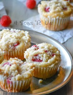 four raspberry muffins on a silver plate