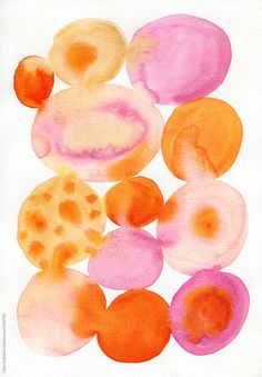 an abstract painting of oranges and pinks on white paper with watercolor stains