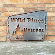 a metal sign on the side of a brick wall