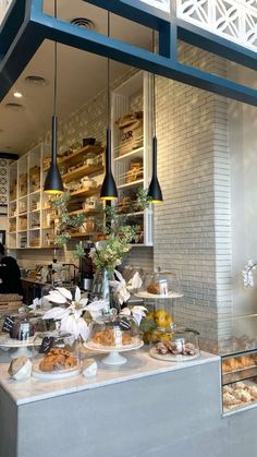 the counter is full of pastries and breads