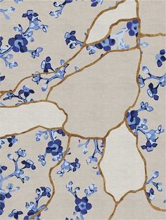 an area rug with blue flowers on it