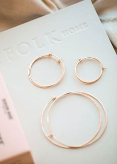 Say hello to these hoops that found a forever home in our hearts. Wire is hand-shaped and lightly hammered for texture. We created three perfect sizes measuring from top to bottom: 1", 1.5" and 2.5" The gauge of these earrings is 19g which is slightly thicker than the average ear wire. They will fit most piercings but may be uncomfortable for very sensitive ears. Sold as a pair. Available in 14kt Gold Fill + Sterling Silver. Handmade in Eau Claire, WI. Our jewelry is handmade so each piece will Hammered Rose Gold Sterling Silver Hoop Earrings, Rose Gold Hammered Sterling Silver Hoop Earrings, Adjustable Hammered Everyday Jewelry, Everyday Adjustable Hammered Jewelry, Adjustable Nickel Free Rose Gold Hoop Earrings, Minimalist Hammered Hoop Earrings For Everyday, Simple Adjustable Small Hoop Jewelry, Adjustable Simple Small Hoop Jewelry, Everyday Hand Forged Hoop Jewelry