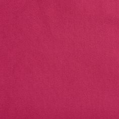 a close up view of a bright pink background