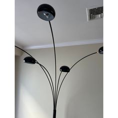 a lamp that is on top of a table next to a wall and ceiling fan