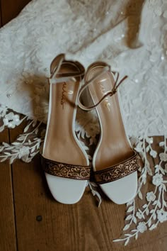 the bride's wedding shoes are on the floor