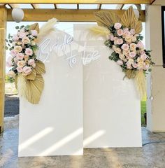 two large white boards with flowers on them