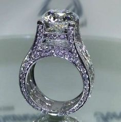 a diamond ring is displayed on a table