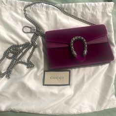 Gucci Evening Bag Purple Velvet Silver-Tone Hardware Leather Trim Chain-Link Shoulder Strap Crystal & Chain-Link Accents Suede Lining Snap Closure At Front Includes Dust Bag Gucci Bag With Silver-tone Hardware For Party, Gucci Party Bag With Silver-tone Hardware, Gucci Pouch Bag With Detachable Strap, Gucci Pouch Bag With Dust Bag Included, Chic Gucci Bag With Silver-tone Hardware, Gucci Shoulder Bag With Silver-tone Hardware For Evening, Gucci Evening Shoulder Bag With Silver-tone Hardware, Gucci Evening Shoulder Bag, Elegant Gucci Clutch Shoulder Bag