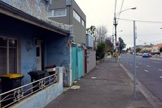 a blue building on the side of a street