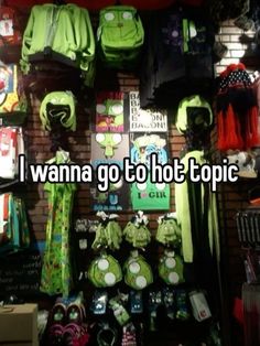 i wanna go to hot topic on the wall in front of some shirts and other items