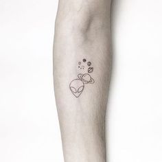 a person with a small tattoo on their arm