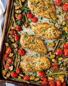 chicken, asparagus and tomatoes in a baking dish