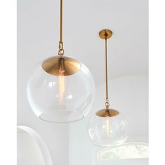 two glass globe lights hanging from the ceiling