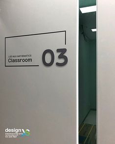 the door is open and there is a sign that says class room 3 on it