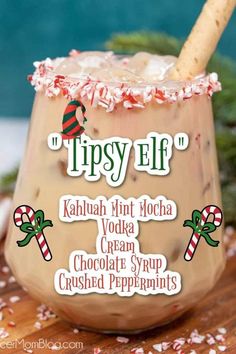 an iced drink with whipped cream and candy canes on the rim, topped with crushed peppermints