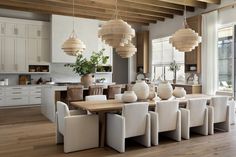 a large dining room table surrounded by white chairs and wooden beams with hanging lights above it