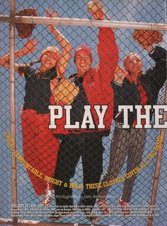 a group of people standing behind a fence with their arms in the air and one holding up a sign that says play the game