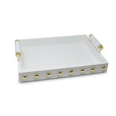 a white and gold tray with two handles