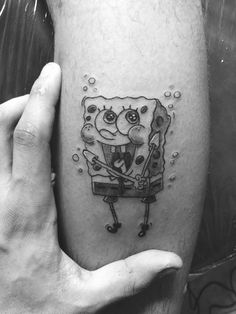 spongebob tattoo on the left thigh