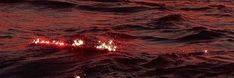 the fire is glowing red in the water