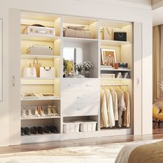 an open closet with clothes and shoes on shelves next to a bed in a room