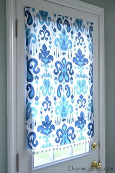 a blue and white patterned window covering