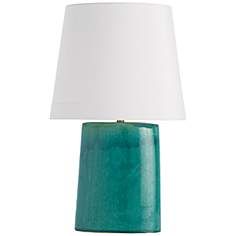 a green table lamp with a white shade on the top and bottom part of it