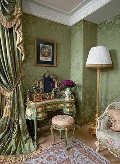 an ornately decorated living room with green walls