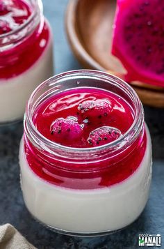 two jars filled with red and white dessert