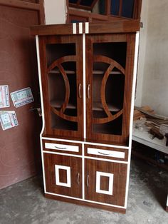 a wooden cabinet with two doors and drawers