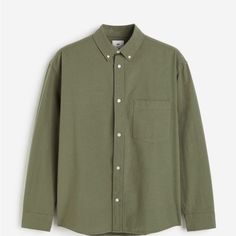 Elevate Your Wardrobe With This Stylish And Comfortable Men's Shirt From The Renowned Brand H&M. This Button-Up Shirt Features A Collared Neckline, Long Sleeves, And A Solid Pattern In Khaki Green Color, Perfect For Any Occasion. The Shirt Is Made Of Breathable Cotton Material That Keeps You Comfortable Throughout The Day. Additionally, The Shirt Showcases An Embroidered Accent With Button Closures And A Slimming Fit, Making It A Perfect Addition To Your Casual Or Formal Wear Collection. This Re H&m Long Sleeve Shirt For Work, H&m Relaxed Fit Shirt With Button Closure, Green Cotton Shirt For Business Casual, Green Relaxed Fit Shirt For Business Casual, Green Cotton Business Casual Shirt, H&m Workwear Tops With Pockets, H&m Cotton Shirt For Everyday Wear, H&m Cotton Shirt For Everyday, H&m Tops With Pockets For Work