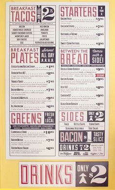 a menu is displayed on the wall in front of a yellow frame with black and white lettering